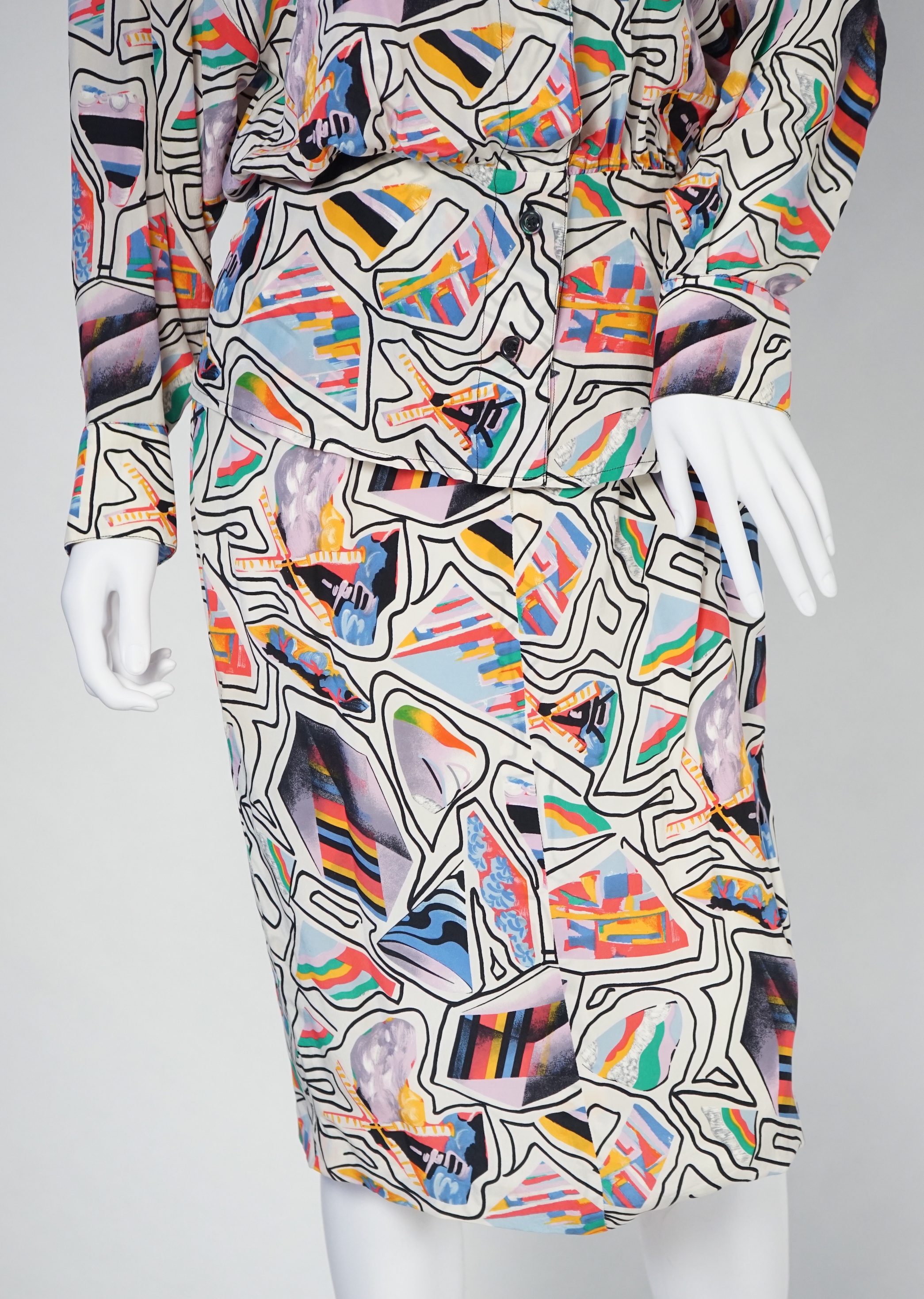 A Karl Lagerfeld lady's multi colour silk suit and a pair of velvet trousers, both size 38